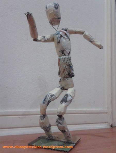 The wire armature serves as the skeleton of the figure and the crumpled newspaper as muscles.